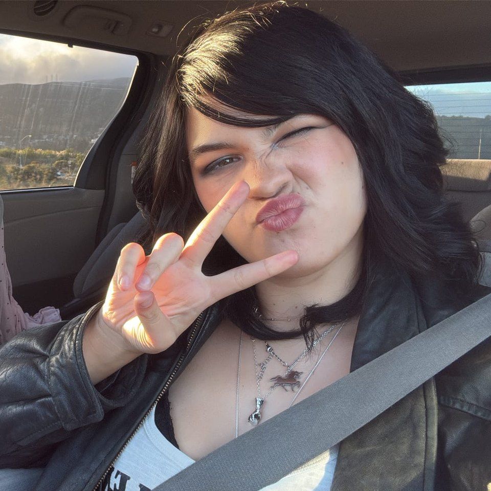Finn throwing a peace sign