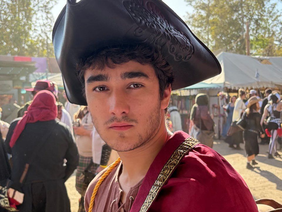 Max as a pirate captain in a tricorn hat and red cape