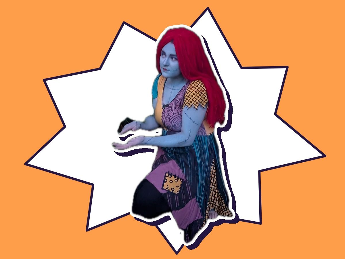 A performer as a Sally-inspired patchwork girl with long red hair