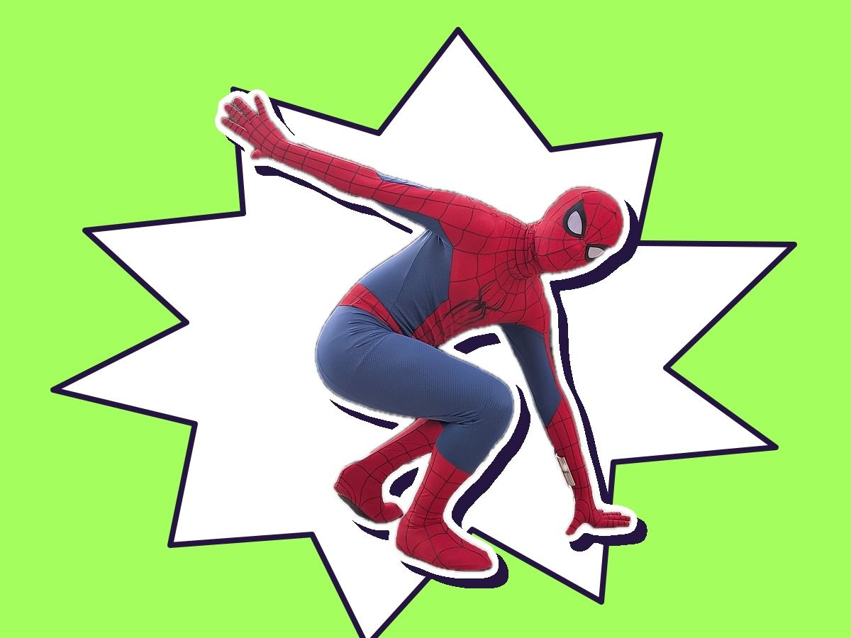 A performer as a Spider-Man-inspired web hero crouched in a hero pose